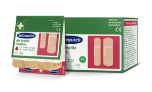 Salvequick packaging for 40 textile plasters, featuring product details including "72 × 19 mm 24 pcs" and "72 × 25 mm 16 pcs" on a green and red background. The box includes illustrations of beige adhesive bandages and text "First Aid for everyone. Everywhere." alongside icons for renewable material and latex-free.
